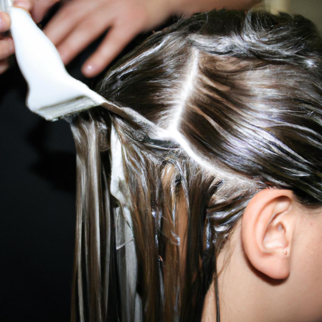Person getting hair highlighted professionally